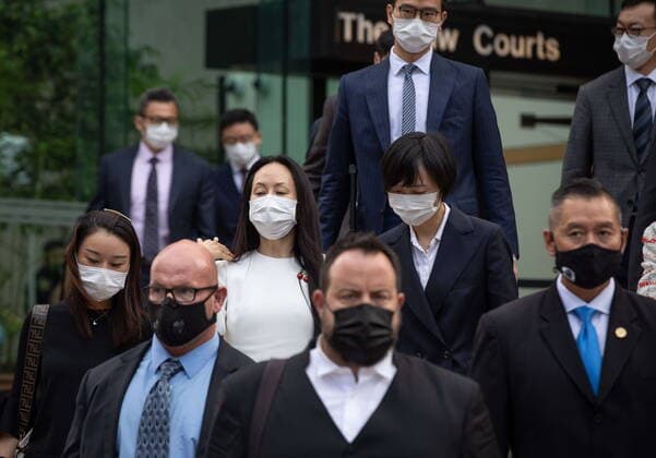 August 17, 2021, Vancouver, BC, Canada: Meng Wanzhou, centre left, chief financial officer of Huawei, leaves B.C. Supreme Court during a break from her extradition hearing, in Vancouver, on Tuesday, August 17, 2021. Vancouver Canada - ZUMAc35_ 20210817_zaf_c35_044 Copyright: xDarrylxDyckx
