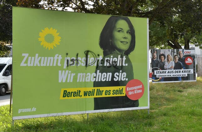 07 09 2021, xblx, politics, election poster federal election 26 09 2021, election advertisement The Greens, Greens, green party, ALLIANCE 90, ANNALENA BAERBOCK, FUTURE DOES NOT HAPPEN, WE MAKE YOU, READY, BECAUSE YOU ARE, smeared poster, beside it advertisement for the CDU Frankfurt