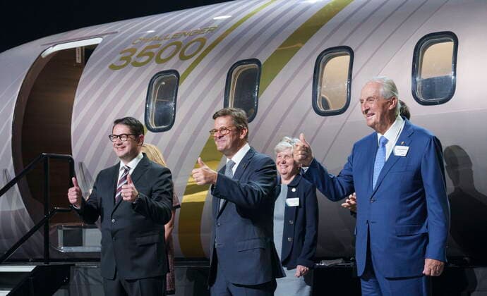 September 14, 2021, Montreal, PQ, Canada: Bombardier president and CEO Eric Martel, left, chairman of the board Pierre Beaudoin, centre, and former CEO Laurent Beaudoin give a thumbs-up in front of a scale model of the new Challenger 3500 in Montreal on Tuesday, September 14, 2021. Montreal Canada - ZUMAc35_ 20210914_zaf_c35_014 Copyright: xPaulxChiassonx