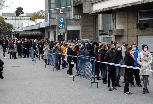Lnes for the coronavirus vaccination at the Zagreb Fair Citizens are seen waiting in lines at the Zagreb Fair for vaccination with the 1st and 2nd dose of the vaccine. The official confirmation of the headquarters has arrived that today is the day with the most deaths from coronavirus, as well as the largest number of infected people since the beginning of the pandemic. In the last 24 hours, 7,094 new cases of SARS-CoV-2 virus infection were recorded, and the number of active cases in Croatia today is a total of 31,689. Among them, 1,786 patients are in hospital treatment, of which 234 patients are on respirators., in Zagreb, Croatia, on November 06, 2021. ZeljkoxHladika PIXSELL