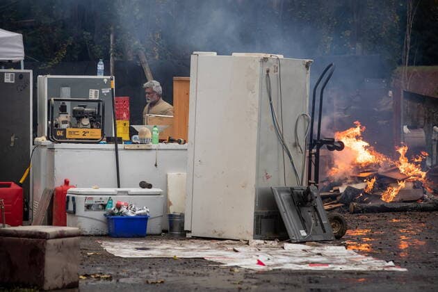 November 23, 2021, ABBOTSFORD, BC, Canada: A farm manager, who asked not to be identified by name, burns spoiled meat and damaged cabinetry after floodwaters filled the lower floor of a house the family rents on a farm, in Abbotsford, B.C., Tuesday, Nov. 23, 2021. ABBOTSFORD Canada - ZUMAc35_ 20211123_zaf_c35_209 Copyright: xDarrylxDyckx