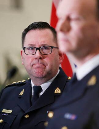 January 27, 2022, WINNIPEG, MANITOBA, CANADA: Manitoba RCMP Superintendent Rob Lasson, major crime services, provides investigation details as Chief Superintendent Rob Hill, Criminal Operations Officer, listens in at a press conference where they provided an update and an identification of the four India citizens who died while crossing the Canada-U.S. border at D Division Headquarters in Winnipeg Thursday, January 27, 2022. Mounties are pleading for information surrounding the deaths of four Indian nationals whose bodies were found frozen in Manitoba near the Canada-U. S. border last week. WINNIPEG CANADA - ZUMAc35_ 20220127_zaf_c35_051 Copyright: xJohnxWoodsx