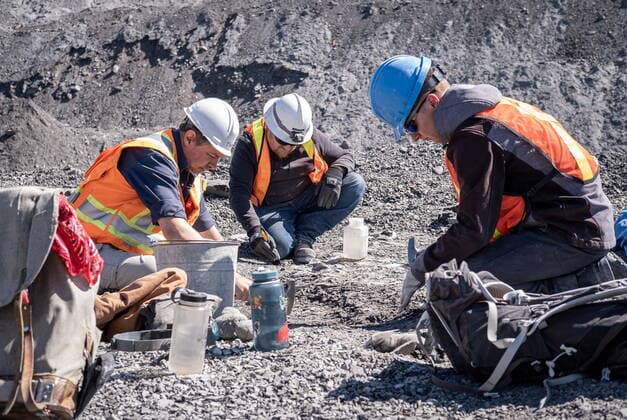 May 11, 2022, Lethbridge, AB, Canada: Technicians from the Royal Tyrell Museum of Palaeontology, Darren Tanke, (left to right) Mark Mitchell and Dawson Lambert work on preserving a mosasaur fossil, Wednesday, May 11, 2022, at the KORITE mine south of Lethbridge, Alta. Lethbridge Canada - ZUMAc35_ 20220511_zaf_c35_096 Copyright: xDavidxRossiterx