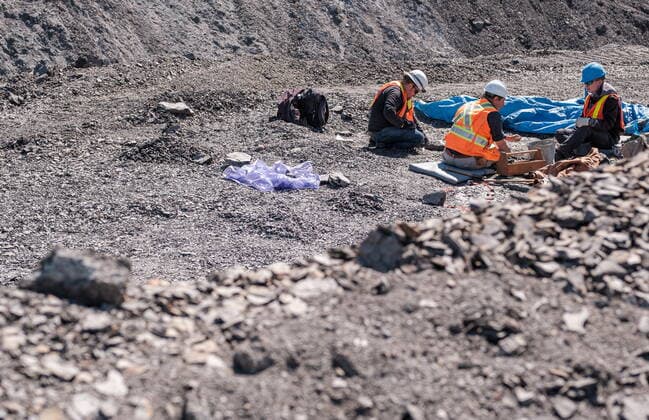 May 11, 2022, Lethbridge, AB, Canada: Technicians from the Royal Tyrell Museum of Palaeontology, Darren Tanke, (left to right) Mark Mitchell and Dawson Lambert work on preserving a mosasaur fossil, Wednesday, May 11, 2022, at the KORITE mine south of Lethbridge, Alta. Lethbridge Canada - ZUMAc35_ 20220511_zaf_c35_104 Copyright: xDavidxRossiterx