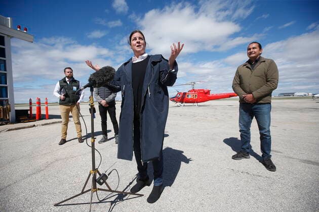 May 15, 2022, WINNIPEG, MB, CANADA: Premier Heather Stefanson speaks at a press conference after a helicopter tour of ManitobaöÄÃ s flood area as Johanu Botha, assistant deputy minister, emergency management and head of ManitobaöÄÃ s Emergency Management Organization, left, and opposition leader Wab Kinew listen in at Winnipeg airport, Sunday, May 15, 2022. WINNIPEG CANADA - ZUMAc35_ 20220515_zaf_c35_095 Copyright: xJohnxWoodsx