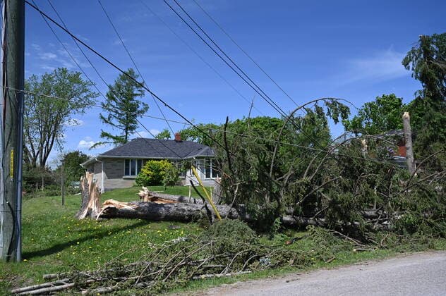 May 24, 2022, Uxbridge, ON, Canada: Snapped trees and down power lines lay on the ground in Uxbridge, Ont., on Tuesday, May 24, 2022, after a major storm hit parts of Ontario on Saturday, May 21, 2022, leaving extensive damage. Uxbridge Canada - ZUMAc35_ 20220524_zaf_c35_134 Copyright: xJonxBlackerx