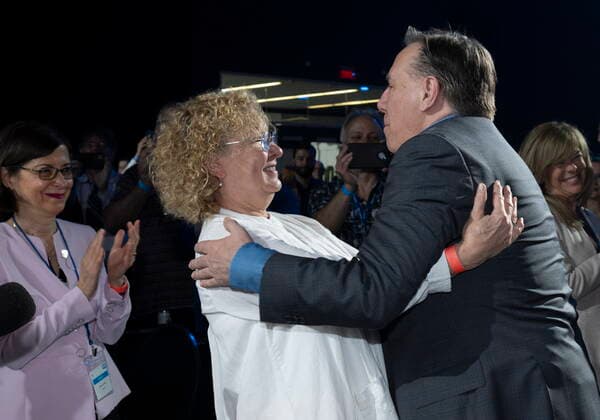 May 28, 2022, DRUMMONDVILLE, PQ, Canada: Quebec Premier Francois Legault, right, hugs Quebec Minister Responsible for Seniors and Informal Caregivers Marguerite Blais while Quebec Minister of Higher Education Danielle McCann, left, applauds at the beginning of a Coalition Avenir Quebec annual congress, in Drummondville, Que., Saturday, May 28, 2022. Neither Blais or McCann will run as candidate for the CAQ in the fall election. DRUMMONDVILLE Canada - ZUMAc35_ 20220528_zaf_c35_007 Copyright: xJacquesxBoissinotx