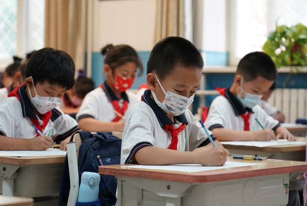 (220627) -- BEIJING, June 27, 2022 -- Students are having a Chinese class at the Pinggu campus of Beijing No. 2 Experimental Primary School in Beijing, capital of China, June 27, 2022. Beijing s primary and middle school students returned to campus on Monday after over 50 days of remote education due to a local COVID-19 resurgence. Students in the first two years of junior high and senior high schools, or grades 7, 8, 10 and 11, as well as those in primary schools, resumed in-person classes. Education for students in grades 9 and 12 concluded earlier. ) CHINA-BEIJING-SCHOOL REOPENING (CN) RenxChao