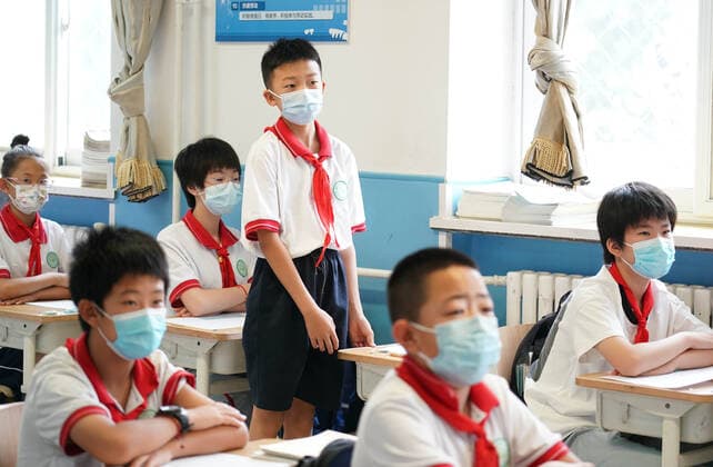 (220627) -- BEIJING, June 27, 2022 -- A student answers a question during a maths class at the Pinggu campus of Beijing No. 2 Experimental Primary School in Beijing, capital of China, June 27, 2022. Beijing s primary and middle school students returned to campus on Monday after over 50 days of remote education due to a local COVID-19 resurgence. Students in the first two years of junior high and senior high schools, or grades 7, 8, 10 and 11, as well as those in primary schools, resumed in-person classes. Education for students in grades 9 and 12 concluded earlier. ) CHINA-BEIJING-SCHOOL REOPENING (CN) RenxChao