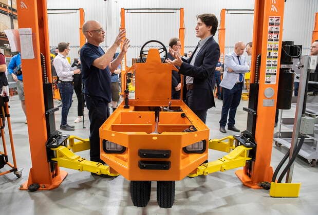 July 12, 2022, Sherbrooke, PQ, Canada: Prime Minister Justin Trudeau, right, talks with Sylvain Fredette during a tour of Motrec, a heavy-duty electric vehicle production facility in Sherbrooke, Que., Tuesday, July 12, 2022. Sherbrooke Canada - ZUMAc35_ 20220712_zaf_c35_019 Copyright: xGrahamxHughesx