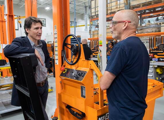 July 12, 2022, Sherbrooke, PQ, Canada: Prime Minister Justin Trudeau, left, talks with Sylvain Fredette during a tour of Motrec, a heavy-duty electric vehicle production facility in Sherbrooke, Que., Tuesday, July 12, 2022. Sherbrooke Canada - ZUMAc35_ 20220712_zaf_c35_020 Copyright: xGrahamxHughesx