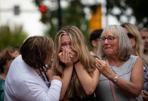 August 3, 2022, LANGLEY, BC, CANADA: Steven Furness daughter Lilee, 14, is comforted by her grandmother Lorraine Furness, right, and a family friend as she cries during a vigil for her father and Paul Wynn, who were killed by a gunman during a series of attacks on homeless people last month, in Langley, B.C., on Wednesday, August 3, 2022. The suspect believed to be responsible for the shooting of four people, including the two fatalities, was shot and killed by the RCMP. LANGLEY CANADA - ZUMAc35_ 20220803_zaf_c35_073 Copyright: xDarrylxDyckx