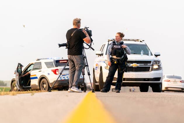 September 7, 2022, Rosthern, SK, Canada: An RCMP officer speaks with a member of media on a road outside Rosthern, Sask., on Wednesday, Sept. 7, 2022. RCMP say Myles Sanderson, a suspect in a deadly stabbing rampage northeast of Saskatoon over the weekend, has been taken into custody near the town of Rosthern on the fourth day of a massive manhunt. Rosthern Canada - ZUMAc35_ 20220907_zaf_c35_144 Copyright: xHeywoodxYux