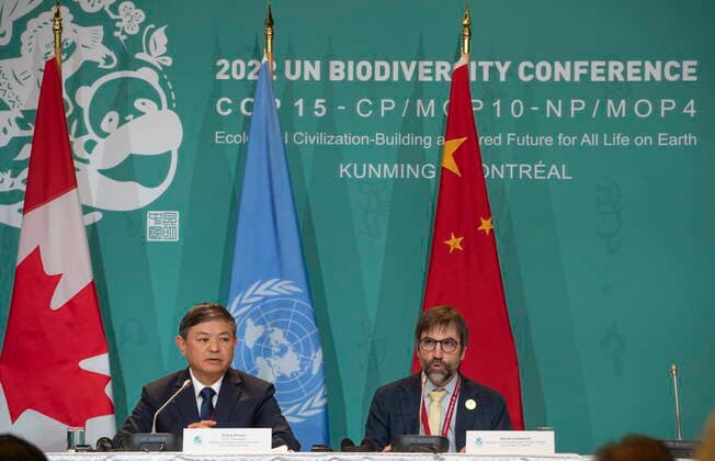 December 17, 2022, Montreal, PQ, CANADA: Huang Runqiu, left, President of the COP 15 and Minister of Ecology and Environment of China listens as Steven Guilbeault, Minister of Environment and Climate Change Canada, speaks during a press conference at the COP 15 summit on biodiversity, in Montreal, Saturday, Dec. 17, 2022. Montreal CANADA - ZUMAc35_ 20221217_zaf_c35_039 Copyright: xPeterxMccabex