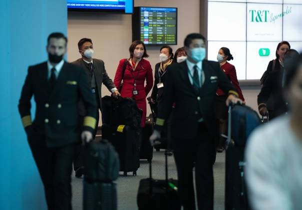 January 4, 2023, RICHMOND, BC, CANADA: Cathay Pacific crew members who worked on a flight from Hong Kong arrive at Vancouver International Airport, in Richmond, B.C., on Wednesday, January 4, 2023. Starting Thursday, Canada will require air travellers from China, Hong Kong and Macau to have a recent negative COVID-19 test result. RICHMOND CANADA - ZUMAc35_ 20230104_zaf_c35_072 Copyright: xDarrylxDyckx