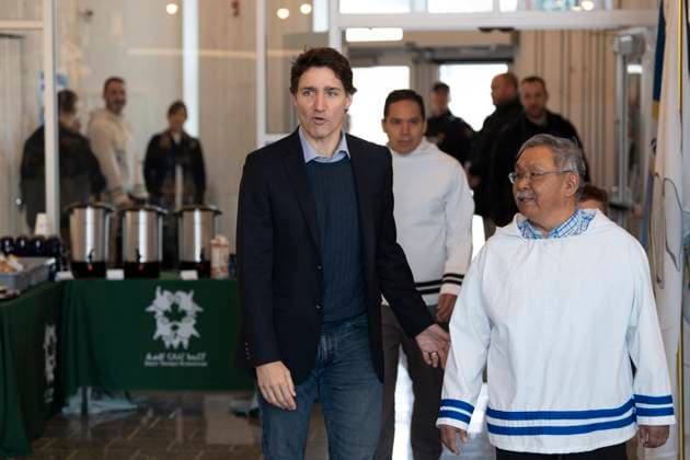 May 12, 2023, Nain, NL, Canada: Prime Minister Justin Trudeau, left, Johannes Lampe, right, president of Nunatsiavut, and Natan Obed, centre back, president of the Inuit Tapiriit Kanatami, arrive for a meeting of the Inuit-Crown Partnership Committee (ICPC) in Nain, N.L. on Friday, May 12, 2023. Nain Canada - ZUMAc35_ 20230512_zaf_c35_004 Copyright: xDarrenxCalabresex