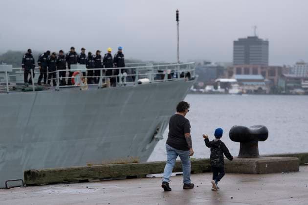 July 3, 2023, Halifax, NS, Canada: Theo Broad, right, 5, waves to his father Petty Officer 2nd Class Tyler Broad, and other sailors during the departure ceremony for HMCS Summerside and HMCS Shawinigan from their homeport in Halifax, Monday, July 3, 2023. HMCS Summerside and Shawinigan are joining Standing NATO Mine Countermeasures as part of Operation REASSURANCE to strengthen security throughout European waters. Halifax Canada - ZUMAc35_ 20230703_zaf_c35_003 Copyright: xDarrenxCalabresex