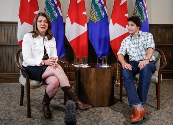 July 7, 2023, Calgary, AB, CANADA: Prime Minister Justin Trudeau, right, meets with Alberta Premier Danielle Smith in Calgary, Alta., Friday, July 7, 2023. Calgary CANADA - ZUMAc35_ 20230707_zaf_c35_028 Copyright: xJeffxMcintoshx