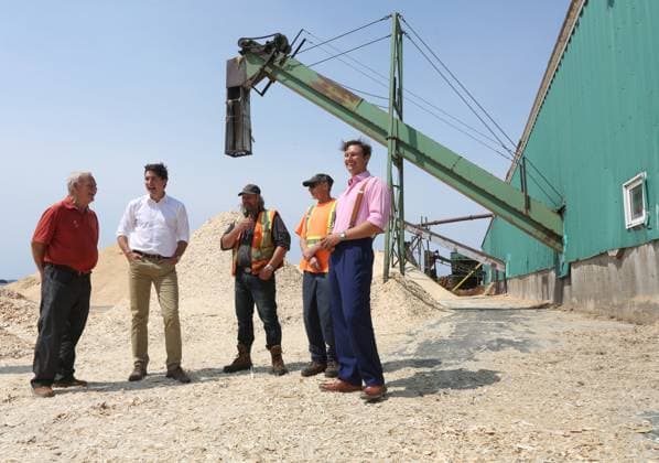 July 27, 2023, Summerford, NL, CANADA: Cottles Island Lumber owner Rex Phillipot, left to right, talks with Prime Minister Justin Trudeau, along with staff, Alwood Hawkins, Rod Gillard and Robin Phillpot during the Prime Ministers visit in Summerford, Newfoundland and Labrador on Thursday, July 27, 2023. Summerford CANADA - ZUMAc35_ 20230727_zaf_c35_008 Copyright: xPaulxDalyx
