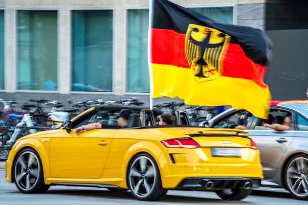 Soccer fans celebrate the German victory in the match against Hungary, driving through Leopoldstraße with German flags, European Football Championship, Munich, June 19, 2024 Germany, Munich, June 19, 2024, Football fans celebrate after the German victory in the match against Hungary, d