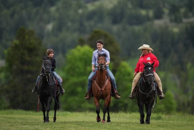 June 26, 2024, Nemaiah Valley, Bc, CANADA: Prime Minister Justin Trudeau and his son Hadrien, 10, ride horses with Shannon Woods, who runs the community s riding program, during celebrations to mark the 10th anniversary of the Tsilhqot in decision, in Nemaiah Valley, B.C., on Wednesday, June 26, 2024. In 2014, the Supreme Court of Canada granted Tsilhqot in aboriginal title to more than 1,750 square kilometres of land in the Nemaiah Valley. Nemaiah Valley CANADA - ZUMAc35_ 20240626_zaf_c35_156 Copyright: xDarrylxDyckx