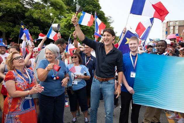 August 15, 2024, Yarmouth, Ns, Canada: Prime Minister Justin Trudeau, centre, and Governor General Mary Simon, centre left, walk in the Tintamarre Parade in Yarmouth, N.S., on Thursday, August 15, 2024. Yarmouth Canada - ZUMAc35_ 20240815_zaf_c35_057 Copyright: xRonxWardx