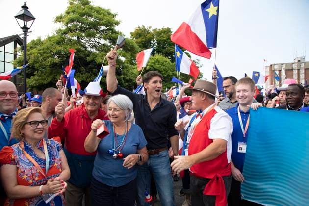 August 15, 2024, Yarmouth, Ns, Canada: Prime Minister Justin Trudeau, centre, and Governor General Mary Simon, centre left, walk in the Tintamarre Parade in Yarmouth, N.S., on Thursday, August 15, 2024. Yarmouth Canada - ZUMAc35_ 20240815_zaf_c35_058 Copyright: xRonxWardx