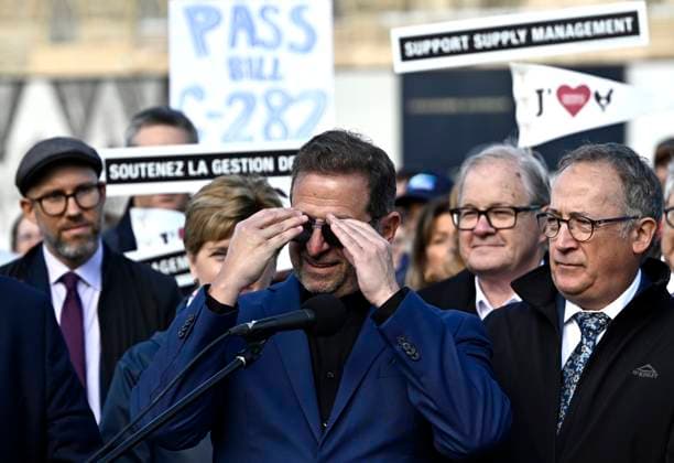 October 10, 2024, Ottawa, On, CAN: Bloc Quebecois Leader Yves-Francois Blanchet, centre, unclips his sunglasses from his prescription glasses as he prepares to speak at a news conference on the lawn of Parliament Hill in Ottawa, on Thursday, Oct. 10, 2024. Members of Parliament from the Bloc Quebecois, NDP, Liberal and Green Parties, federal cabinet ministers and agriculture producers participated in the event to urge the Senate to pass Bill C-282 on supply management. Ottawa CAN - ZUMAc35_ 20241010_zaf_c35_054 Copyright: xJustinxTangx