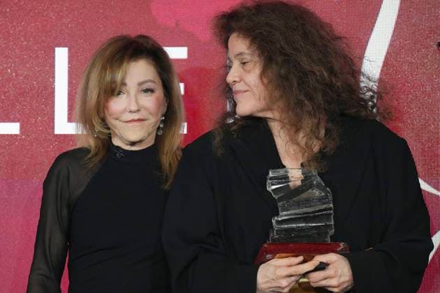 November 18, 2024, Toronto, Ontario, Canada: ANNE MICHAELS, 66, ANNE MICHAELS (right) looks over to ELANA RABINOVITCH, the Executive Director of Giller Prize as she accepts the Giller Prize of $100,000 for her book Held a multigenerational look at war and trauma spanning more than a century. The jury cited the novel as an impactful and hypnotic exploration of mortality, resilience and desires, at ceremony in Toronto, Monday. Award boycotted by several prominent Canadian authors over its sponsors’ ties to Israel. Based in Toronto, Michaels a poet and author. In her acceptance speech, said that her writing is a way of bearing witness against war, indifference, against amnesia of every sort. Toronto Canada - ZUMAc35_ 20241118_zaf_c35_171 Copyright: xChrisxYoungx