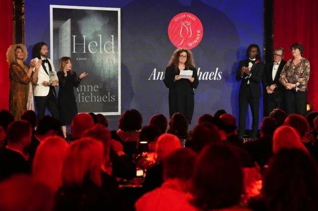 November 18, 2024, Toronto, Ontario, Canada: ANNE MICHAELS, 66, accepts the Giller Prize of $100,000 for her book Held a multigenerational look at war and trauma spanning more than a century. The jury cited the novel as an impactful and hypnotic exploration of mortality, resilience and desires, at ceremony in Toronto, Monday. Award boycotted by several prominent Canadian authors over its sponsors’ ties to Israel. Based in Toronto, Michaels a poet and author. In her acceptance speech, said that her writing is a way of bearing witness against war, indifference, against amnesia of every sort. Toronto Canada - ZUMAc35_ 20241118_zaf_c35_172 Copyright: xChrisxYoungx