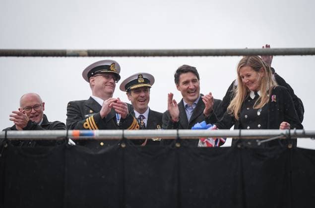 December 13, 2024, North Vancouver, Bc, CANADA: Seaspan Shipyards CEO John McCarthy, from left to right, HMCS Protecteur captain Landon Creasy, Royal Canadian Navy Commander, vice-admiral Angus Topshee and Prime Minister Justin Trudeau applaud after ship sponsor Teri McKinnon, front right, broke a bottle of champagne on the bow of the new Royal Canadian Navy Joint Support vessel, during a launch and naming ceremony at Seaspan Shipyards in North Vancouver, B.C., on Friday, December 13, 2024. The ship is scheduled to be delivered to the Royal Canadian Navy in 2025. North Vancouver CANADA - ZUMAc35_ 20241213_zaf_c35_091 Copyright: xDarrylxDyckx