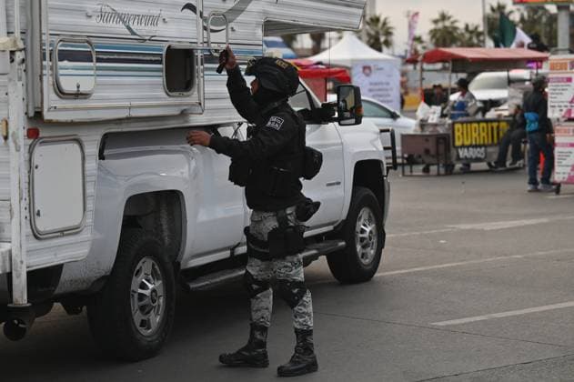 February 6, 2025, Tijuana, Baja California, Mexico: A Mexican National Guard officer check a vehicle heading to the United States into San Diego, California at the San Ysidro Port of Entry crossing in Tijuana, Baja California, Mexico, on Thursday, February 6, 2025. At the southern border between the US and Mexico a planned distribution of 10,000 Mexican National Guard troops on the US border, under an agreement with US President Donald Trump to stop the flow of migration and drugs like fentanyl. Tijuana Mexico - ZUMAm180 20250206_zip_m180_015 Copyright: xCarlosxA.xMorenox