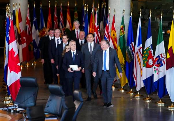 March 21, 2025, Ottawa, Ontario, Canada: Prime Minister Mark Carney, front, walks alongside Francois Legault, Premier of Quebec, as they are joined by first ministers as they arrives to take part in the First Minister Meeting at the National War Museum in Ottawa on Friday, March 21, 2025. Ottawa Canada - ZUMAc35_ 20250321_zaf_c35_067 Copyright: xSeanxKilpatrickx