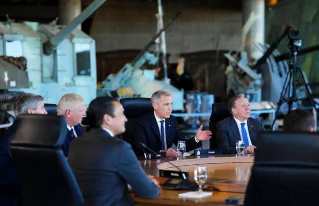 March 21, 2025, Ottawa, Ontario, Canada: Prime Minister Mark Carney, speaks as he is flanked by Doug Ford, Premier of Ontario, left, and Francois Legault , Premier of Quebec, as they gather to take part in the First Minister Meeting at the National War Museum in Ottawa on Friday, March 21, 2025. Ottawa Canada - ZUMAc35_ 20250321_zaf_c35_089 Copyright: xSeanxKilpatrickx
