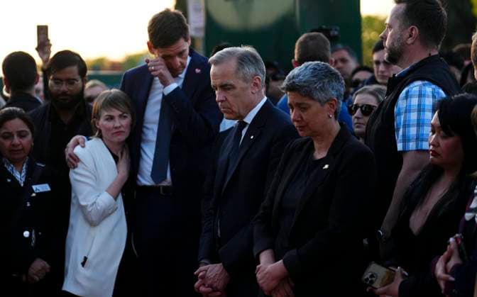 April 27, 2025, Vancouver, Bc, Canada: Liberal Leader Mark Carney stands with members of the Filipino community alongside Mable Elmore, MLA for Vancouver Kensington, with B.C. Premier David Eby and his wife Cailey Lynch as they visit a memorial for the Lapu Lapu Day block party tragedy in Vancouver, B.C., on Sunday, April 27, 2025. Shock and grief rippled through Canada s Filipino community on Sunday as members struggled to come to grips with an attack at a cultural street festival in Vancouver on Saturday that killed 11 people and injured dozens more. Vancouver Canada - ZUMAc35_ 20250427_zaf_c35_135 Copyright: xSeanxKilpatrickx
