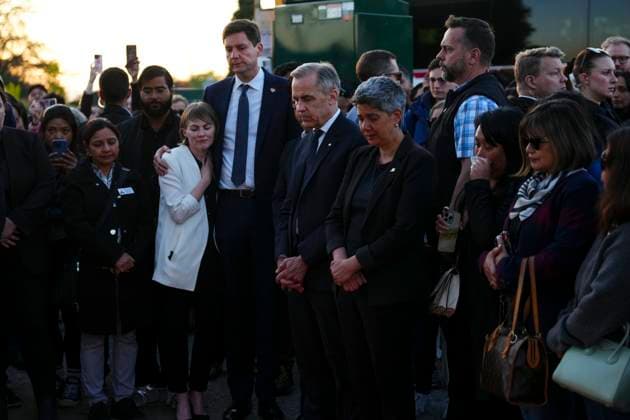 April 27, 2025, Vancouver, Bc, Canada: Liberal Leader Mark Carney stands with members of the Filipino community alongside Mable Elmore, MLA for Vancouver Kensington, with B.C. Premier David Eby and his wife Cailey Lynch as they visit a memorial for the Lapu Lapu Day block party tragedy in Vancouver, B.C., on Sunday, April 27, 2025. Shock and grief rippled through Canada s Filipino community on Sunday as members struggled to come to grips with an attack at a cultural street festival in Vancouver on Saturday that killed 11 people and injured dozens more. Vancouver Canada - ZUMAc35_ 20250427_zaf_c35_139 Copyright: xSeanxKilpatrickx