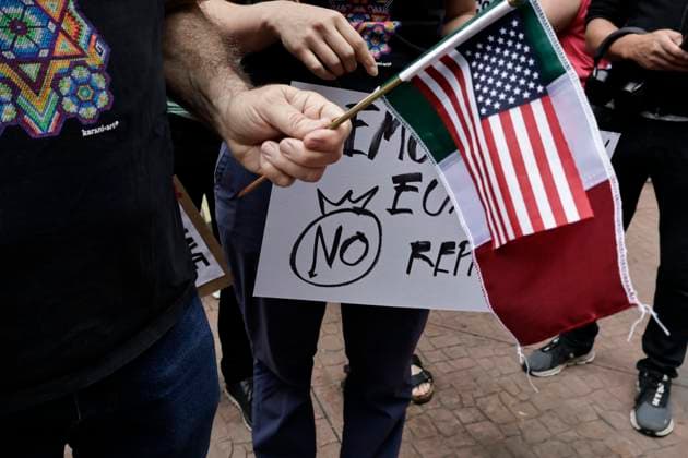 June 14, 2025, Mexico, Cdmx, Mexico: Not only in the Americas are protesting against President Donald Trump, but also abroad, a group of American citizens are taking to the streets of Mexico City toward the United States Embassy to show their disapproval and rejection of the recent violent actions, illegal deportations, and arrests against legal and illegal immigrants in Los Angeles and other sanctuary states. This anti-Trump demonstration is taking place on his birthday, to let him know that he is not a king, that they do not want tyrants, and that they will not celebrate the violence the Trump administration is inflicting on their own people. Mexico Mexico - ZUMAp204 20250614_zip_p204_001 Copyright: xJosuexPerezx