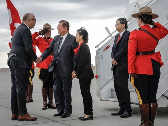 June 15, 2025, Calgary, Ab, CANADA: Japanese Prime Minister Shigeru Ishiba, centre left, and his wife Yoshiko Ishiba are greeted as they arrive in Calgary, Alta., Sunday, June 15, 2025, to attend the G7 Leaders meeting taking place in the nearby community of Kananaskis. Calgary CANADA - ZUMAc35_ 20250615_zaf_c35_219 Copyright: xJeffxMcintoshx