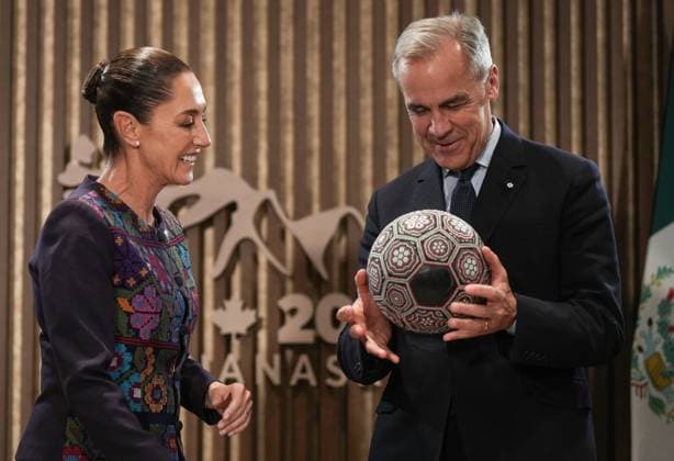 June 17, 2025, Kananaskis, Ab, CANADA: Canadian Prime Minister Mark Carney, right, spins a soccer ball with beaded Huichol art on it after being gifted it by Mexican President Claudia Sheinbaum, before a meeting at the G7 Summit in Kananaskis, Alta., on Tuesday, June 17, 2025. Kananaskis CANADA - ZUMAc35_ 20250617_zaf_c35_257 Copyright: xDarrylxDyckx