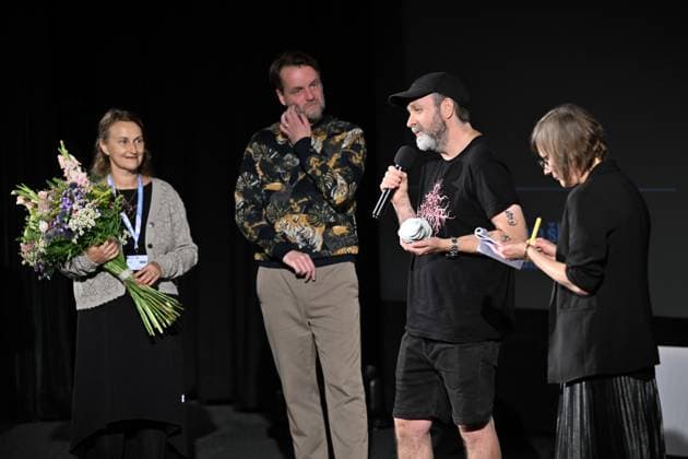 Lukas Moodysson, Swedish poet, novelist, film director and non-conformist, one of the most prominent personalities of the local culture in general, receives the ACFK Annual Award within the 51st Summer Film School in Uherske Hradiste, Czech Republic, July 27, 2025. From left: festival director Radana Korena, programme director Jan Jilek, director Lukas Moodysson and translator Bara Stefanova. (CTKxPhoto DaliborxGluck) CTKPhotoP2025072705411 CTKPhotoP2025072705411