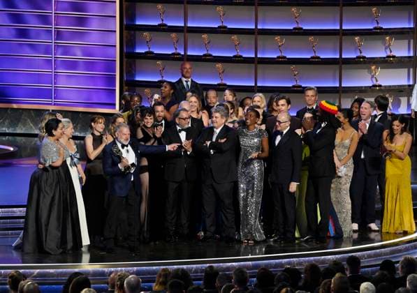 Cast and crew including Simran Baidwan, Katherine LaNasa, R. Scott Gemmill, Noah Wyle, John Wells, Tracy Ifeachor, Shawn Hatosy, Christopher Meloni, Patrick Ball, Supriya Ganesh and Taylor Dearden accept the Outstanding Drama Series award for The Pitt onstage at the 77th annual Primetime Emmy Awards at the Peacock Theater in Los Angeles on Sunday, September 14, 2025. LAP202509145002 JIMxRUYMEN
