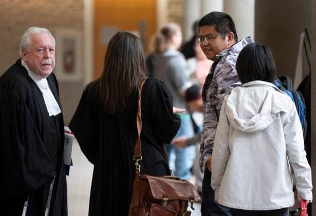 October 6, 2025, Longueuil, Pq, CANADA: Defence lawyer Gary Martin, left, meets his client Yuesheng Wang and his partner as they arrive for his espionage trial at the Longueuil courthouse in Longueuil, Que., on Monday, Oct. 6, 2025. Longueuil CANADA - ZUMAc35_ 20251006_zaf_c35_005 Copyright: xChristinnexMuschix