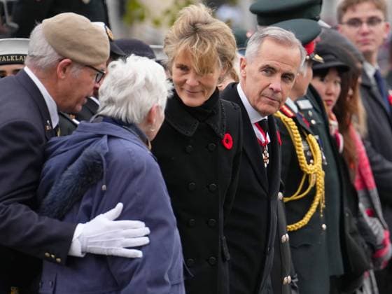 November 11, 2025, Ottawa, On, Canada: Prime Minister Mark Carney and his wife Diana Fox Carney, greet National Silver Cross Mother, Mrs. Nancy Payne, of Lansdowne, Ont., during a Remembrance Day ceremony in Ottawa on Tuesday, Nov. 11, 2025. Ottawa Canada - ZUMAc35_ 20251111_zaf_c35_016 Copyright: xSeanxKilpatrickx