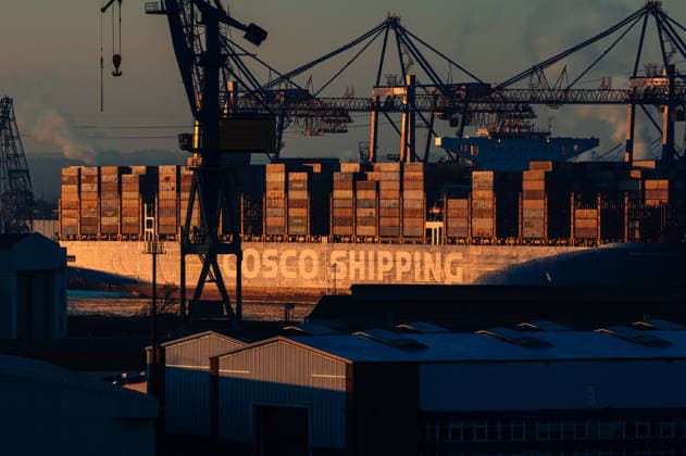 Germany, Hamburg, port, Elbe, COSCO, Cosco Shipping Libra, container ship, terminal facilities, container gantry cranes, morning sun, sunrise, winter, cinematic look, silhouettes, industrial backdrop, port cranes, stacking containers, port logistics Copyright: xStefanxTrochax