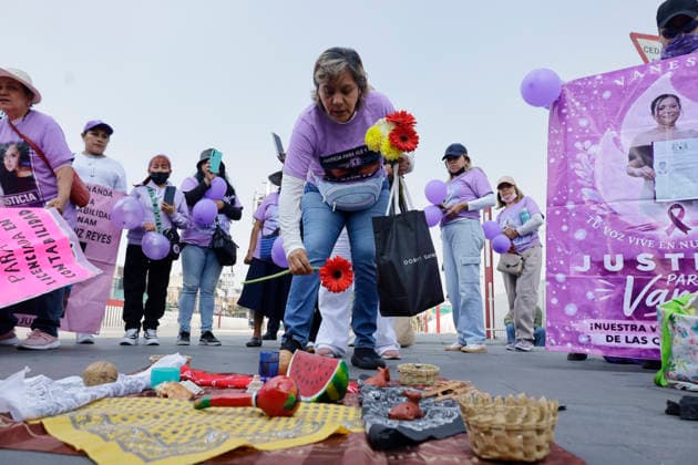 March 8, 2026, ChimalhuacaN, State Of Mexico, Mexico: Teresa Gutià rrez, mother of Andrea and Alejandra, victims of femicide, places flowers on an altar beneath the statue of the Chimalli Warrior, who marched to the municipal seat of Chimalhuacan in the State of Mexico to demand justice and punishment for the perpetrators, on the occasion of International Women s Day in Mexico. According to the United Nations, International Women s Day is commemorated in many countries around the world. When women from all continents, often separated by national borders and ethnic, linguistic, cultural, economic and political differences, come together on this day, they can contemplate a tradition of no less than ninety years of struggle for equality, jus - ZUMAs197 20260308_aaa_s197_488 Copyright: xGerardoxVieyrax