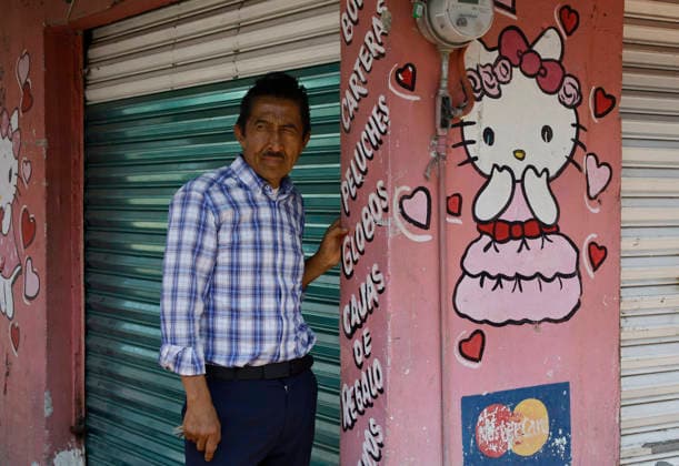 March 8, 2026, ChimalhuacaN, State Of Mexico, Mexico: A person outside a building observes mothers and relatives of victims of disappearance and femicide marching toward the municipal seat of Chimalhuacan in the State of Mexico to demand justice and punishment for the perpetrators, on the occasion of International Women s Day in Mexico. According to the United Nations, International Women s Day is commemorated in many countries around the world. When women from all continents, often separated by national borders and ethnic, linguistic, cultural, economic and political differences, come together on this day, they can contemplate a tradition of no less than ninety years of struggle for equality, justice, peace and development. Chimalhuaca - ZUMAs197 20260308_aaa_s197_553 Copyright: xGerardoxVieyrax