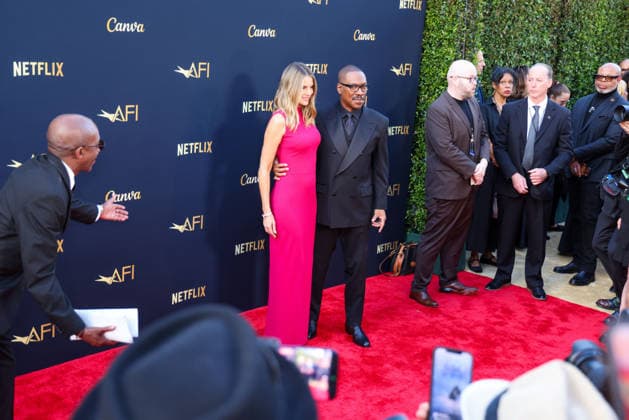 April 18, 2026, Hollywood, California, USA: American Actor and Comedian EDDIE MURPHY, 65, and his Australian Actress wife PAIGE BUTCHER, 46, in a Barbie-pink dress, is on the Red Carpet before Murphy receives the American Film Instituteâ€⠢s (AFI) Life Time Achievement Award on April 18, 2026 in Hollywood, California at the Dolby Theater, Los Angeles. The event is sponsored by Netflix. Hollywood USA - ZUMAk144 20260418_znp_k144_007 Copyright: xAmyxKatzx