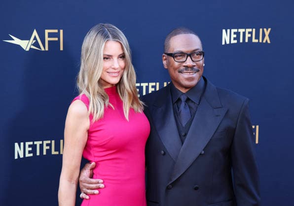 April 18, 2026, Hollywood, California, USA: American Actor and Comedian EDDIE MURPHY, 65, and his Australian Actress wife PAIGE BUTCHER, 46, in a Barbie-pink dress, is on the Red Carpet before Murphy receives the American Film Instituteâ€⠢s (AFI) Life Time Achievement Award on April 18, 2026 in Hollywood, California at the Dolby Theater, Los Angeles. The event is sponsored by Netflix. Hollywood USA - ZUMAk144 20260418_znp_k144_008 Copyright: xAmyxKatzx