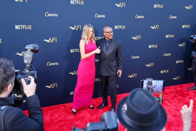 April 18, 2026, Hollywood, California, USA: American Actor and Comedian EDDIE MURPHY, 65, and his Australian Actress wife PAIGE BUTCHER, 46, in a Barbie-pink dress, is on the Red Carpet before Murphy receives the American Film Instituteâ€⠢s (AFI) Life Time Achievement Award on April 18, 2026 in Hollywood, California at the Dolby Theater, Los Angeles. The event is sponsored by Netflix. Hollywood USA - ZUMAk144 20260418_znp_k144_019 Copyright: xAmyxKatzx