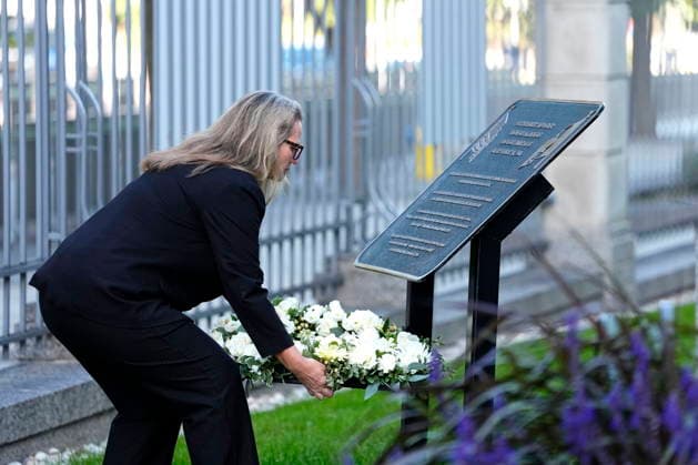 September 11, 2026, Ottawa, On, Canada: Erika Olson, Deputy Chief of Mission, places a wreath in front of a plaque thanking Canada for its support on 9 11, during a commemoration of the 25th anniversary the attacks, at the U.S. Embassy in Ottawa, on Friday, Sept. 11, 2026. Ottawa Canada - ZUMAc35_ 20260911_zaf_c35_003 Copyright: xJustinxTangx